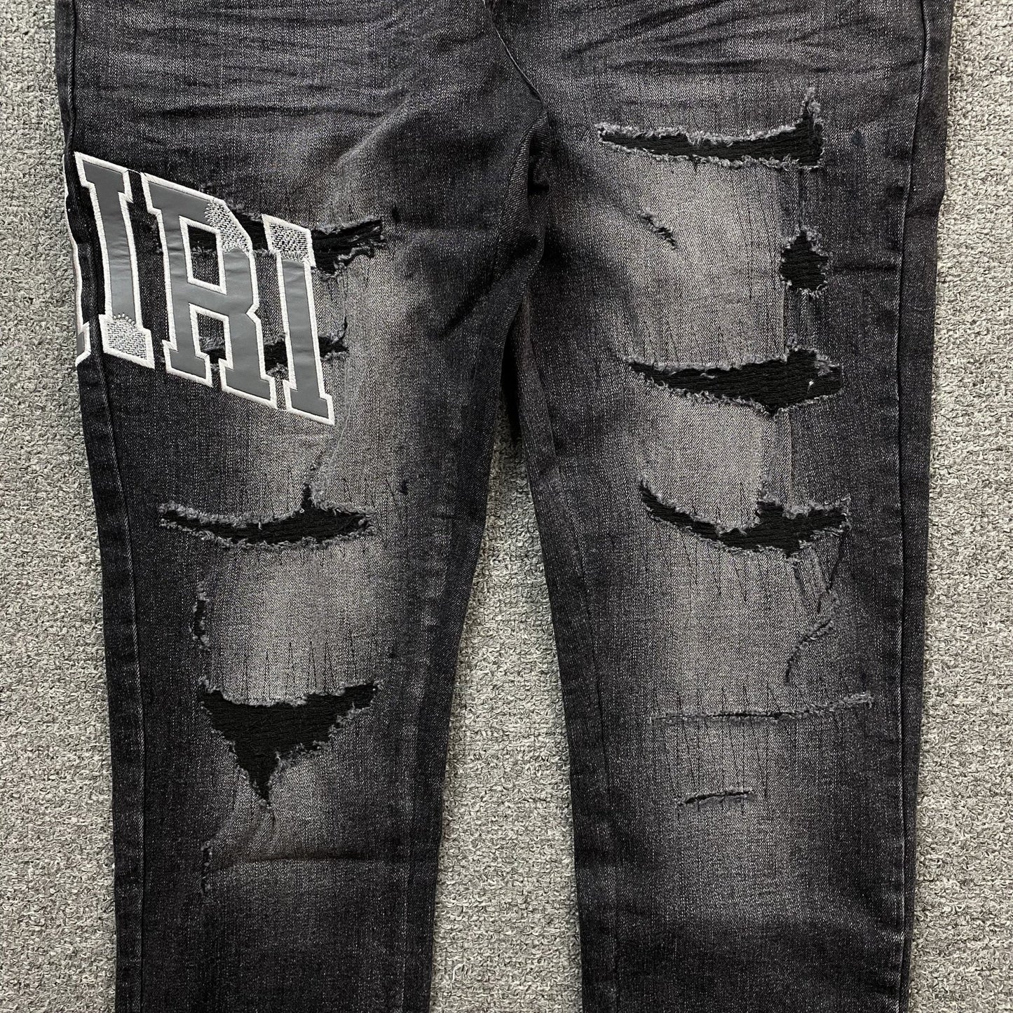 AMIRI VARSITY LOGO REPAIR JEANS - Sin Sity Reps