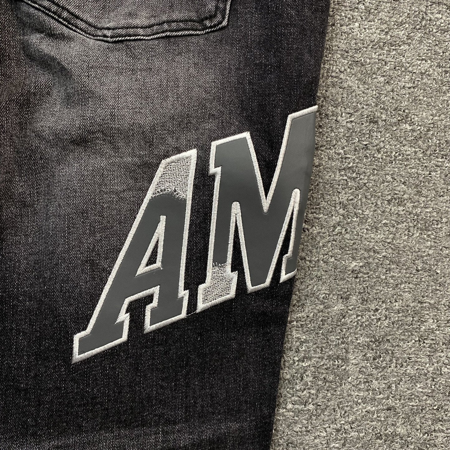 AMIRI VARSITY LOGO REPAIR JEANS - Sin Sity Reps