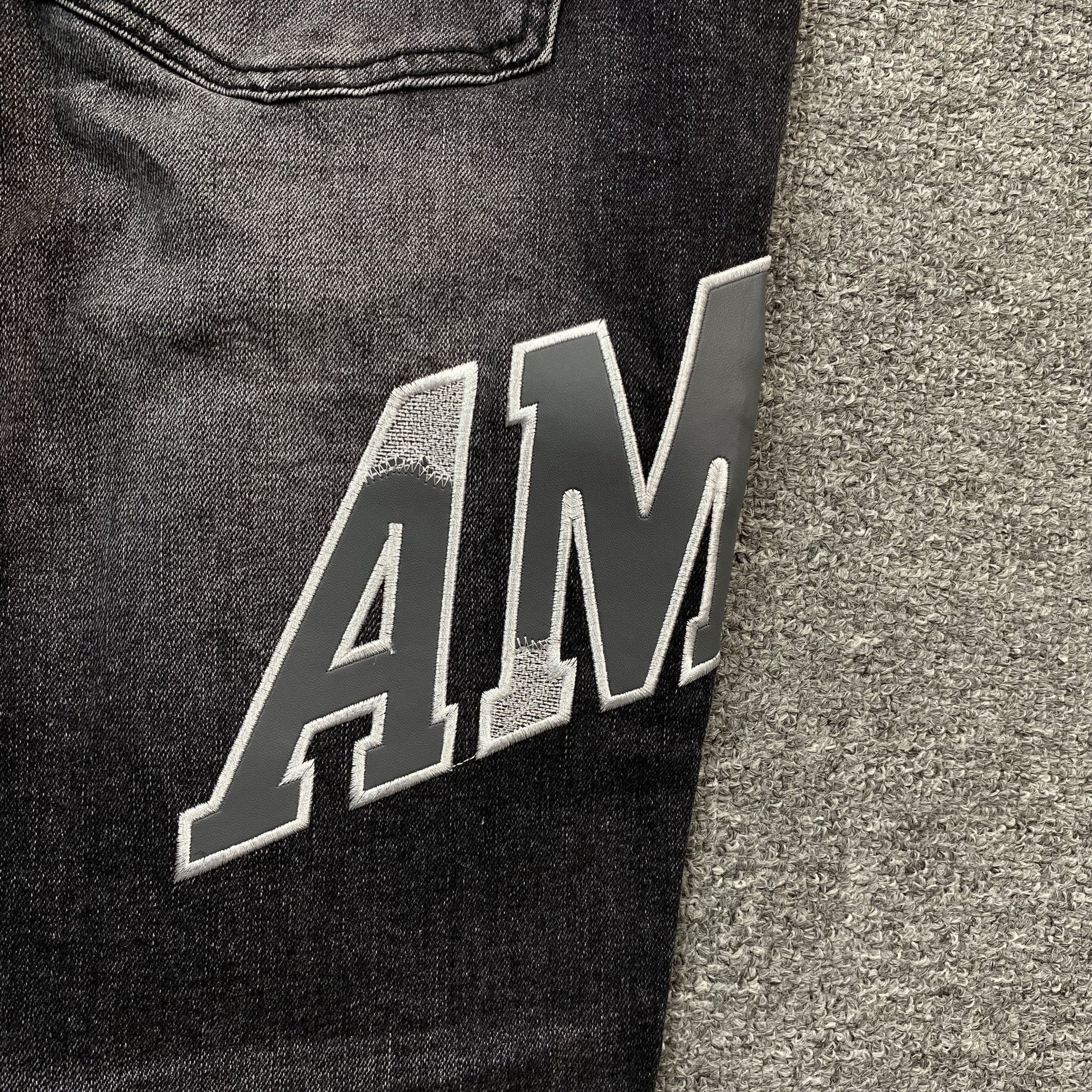 AMIRI VARSITY LOGO REPAIR JEANS - Sin Sity Reps