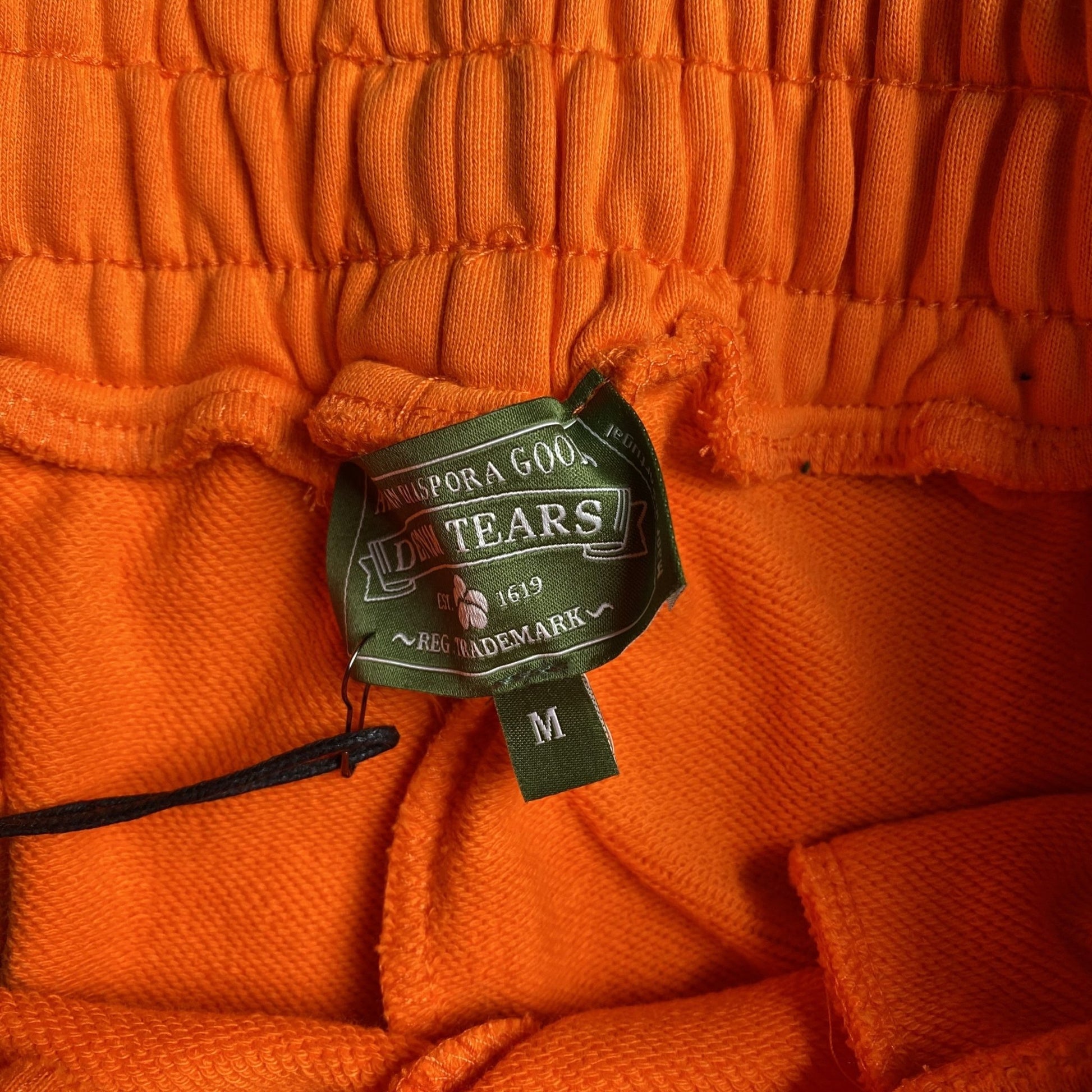 DENIM TEARS COTTON WREATH SWEATPANTS ORANGE - Sin Sity Reps