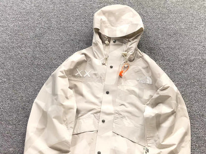 KAWS x THE NORTH FACE RETRO 1986 MOUNTAIN JACKET MOONLIGHT IVORY - Sin Sity Reps