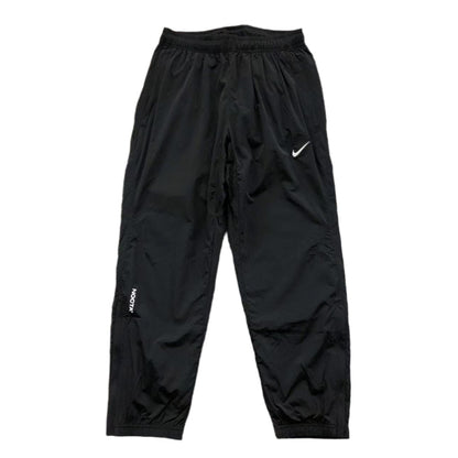 NIKE x NOCTA NORTHSTAR NYLON TRACK PANTS BLACK - Sin Sity Reps