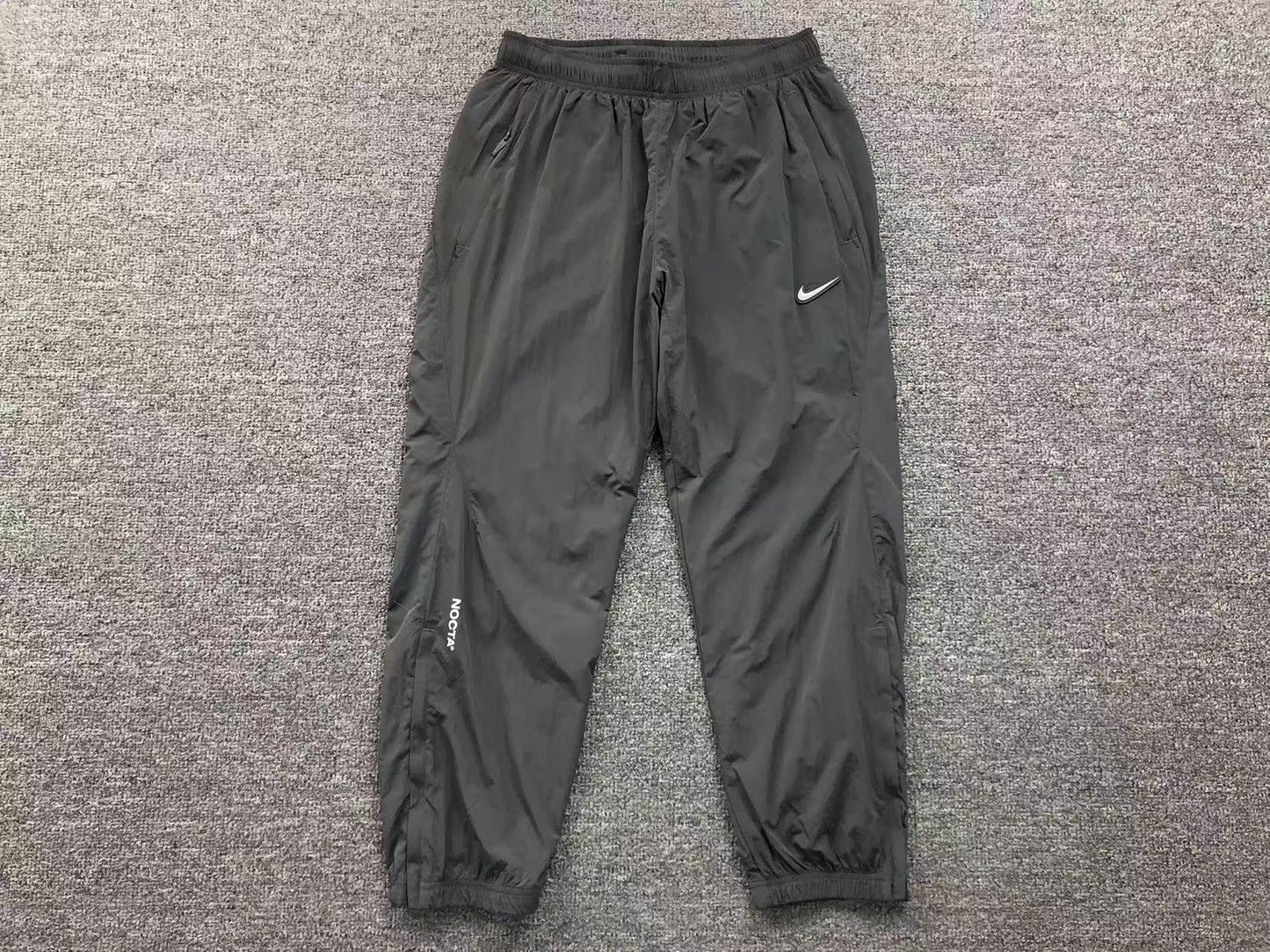 NIKE x NOCTA NORTHSTAR NYLON TRACK PANTS IRON GREY - Sin Sity Reps