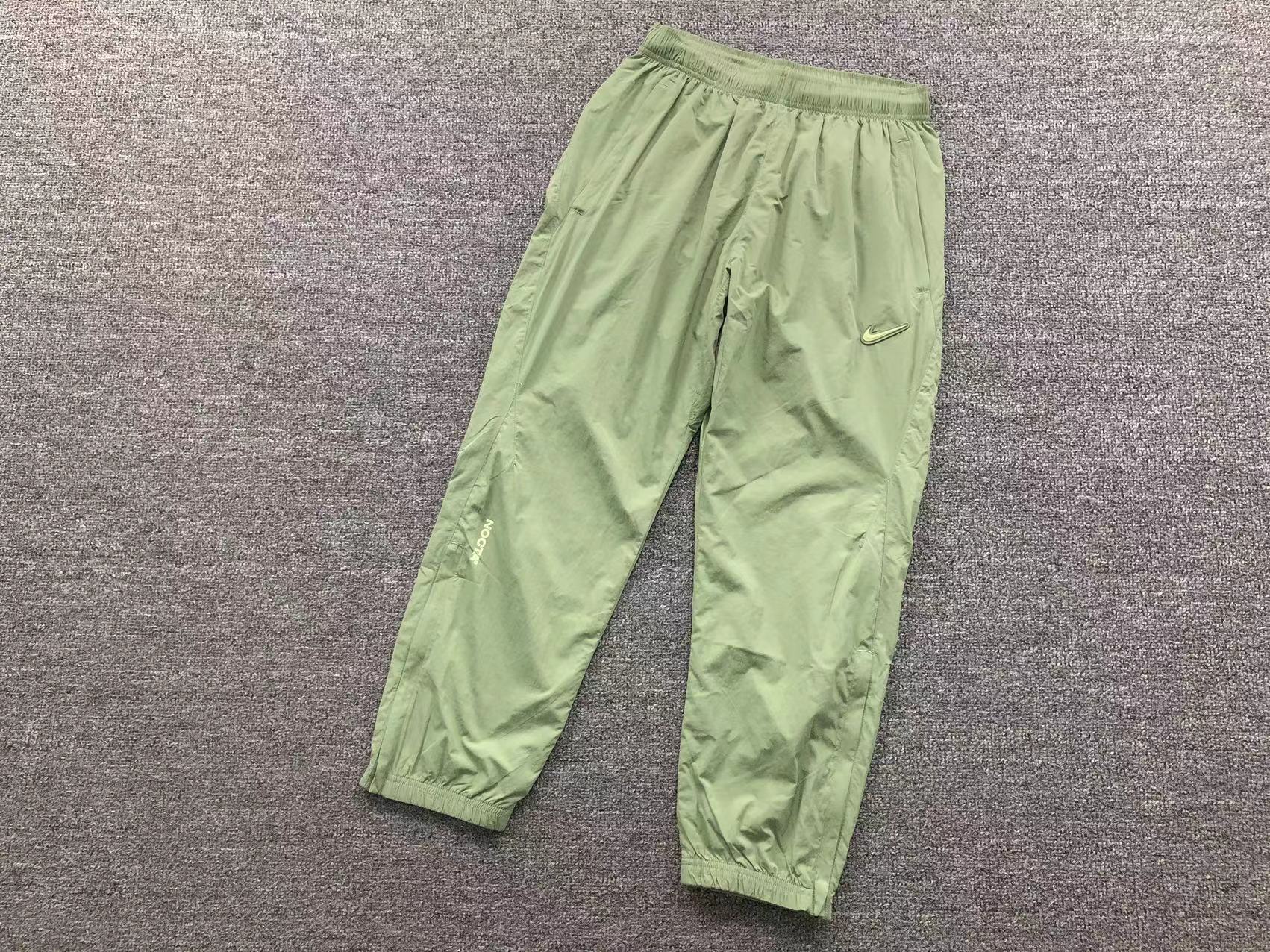 NIKE x NOCTA NORTHSTAR NYLON TRACK PANTS OIL GREEN/LIGHT LIQUID LIME - Sin Sity Reps