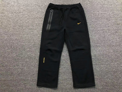 NIKE x NOCTA TECH FLEECE SWEATPANTS BLACK GOLD - Sin Sity Reps