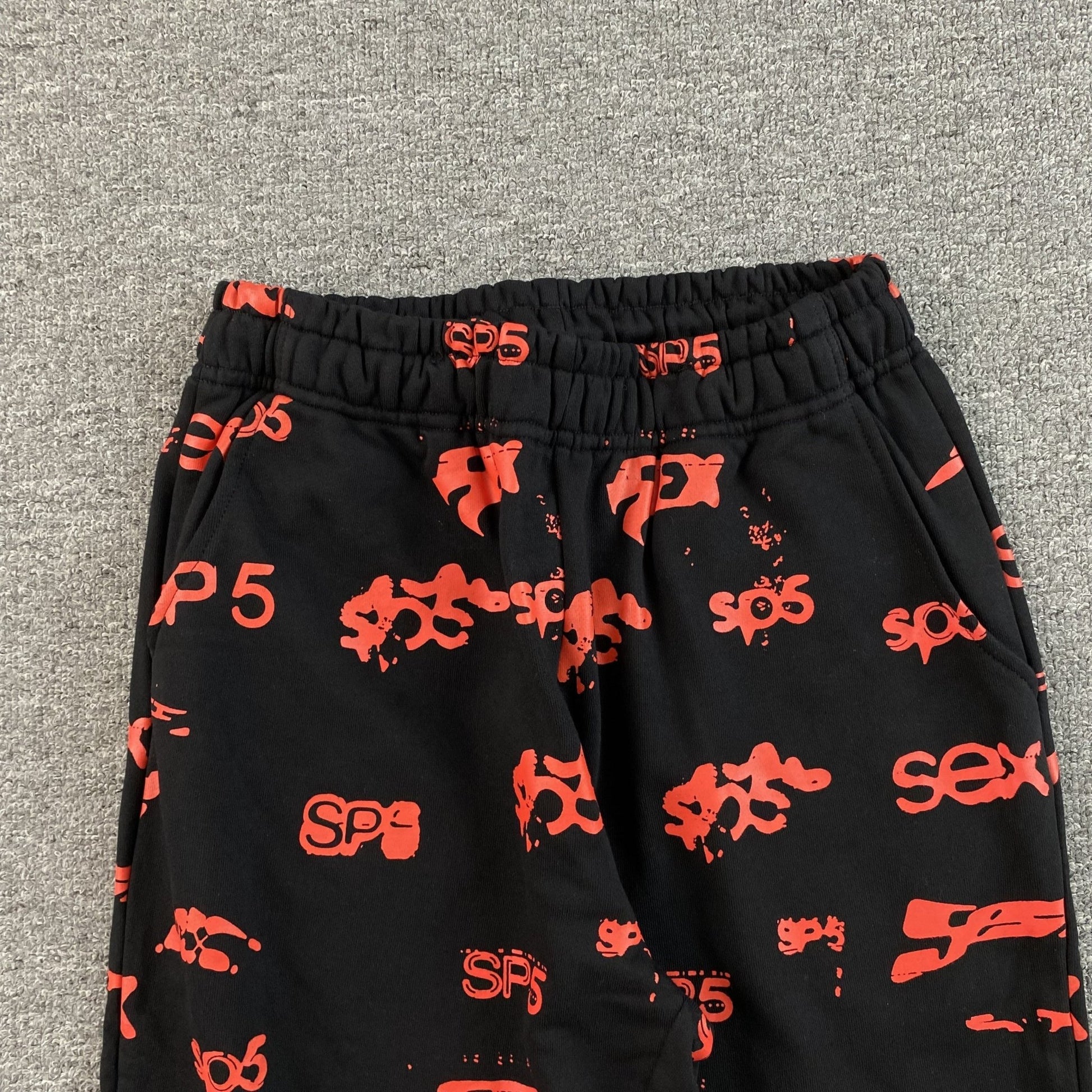 SP5DER SEX AOP SWEATPANTS BLACK - Sin Sity Reps